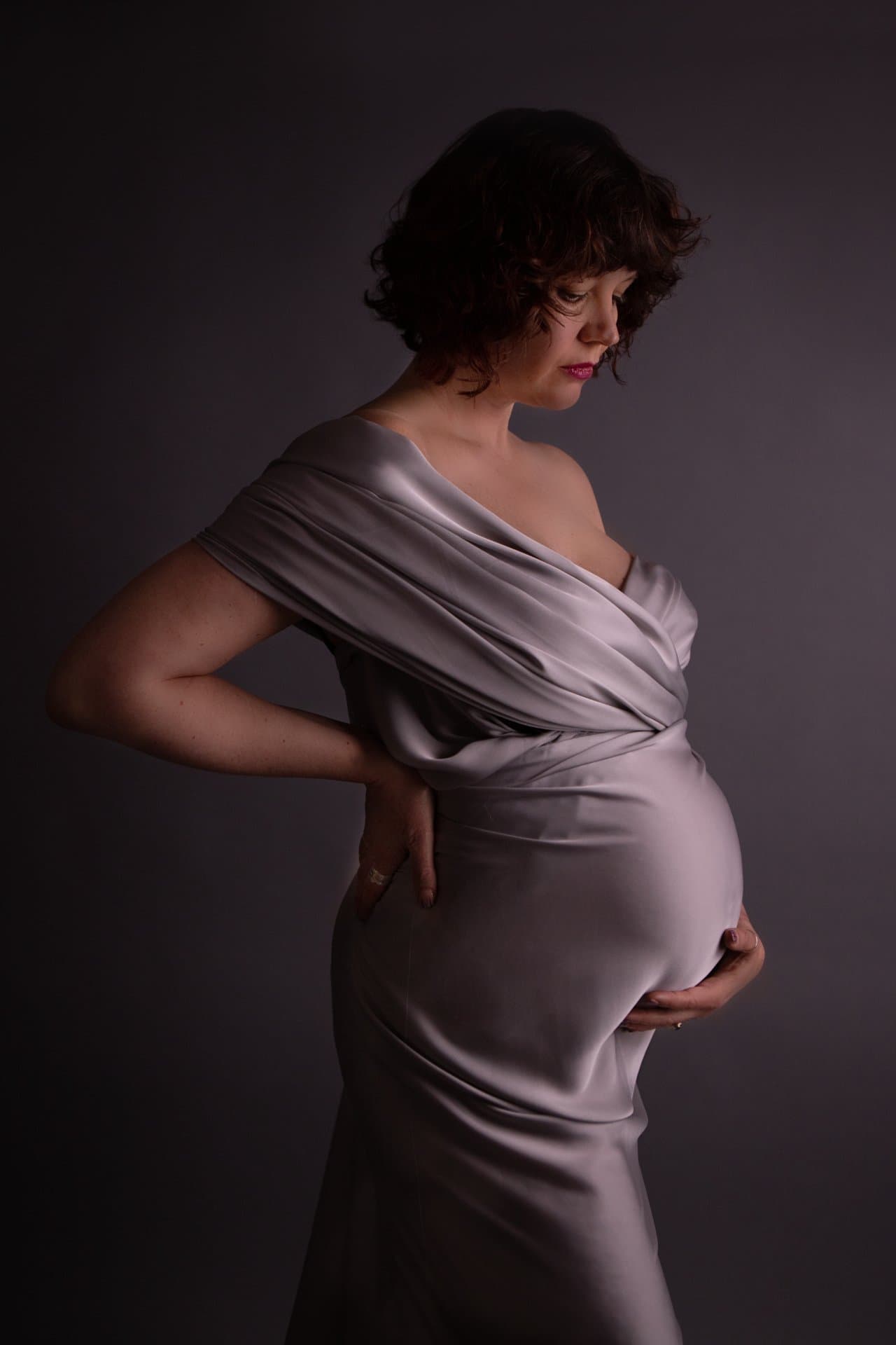 Maternity photography in a light-filled Sheffield studio with flowing fabrics